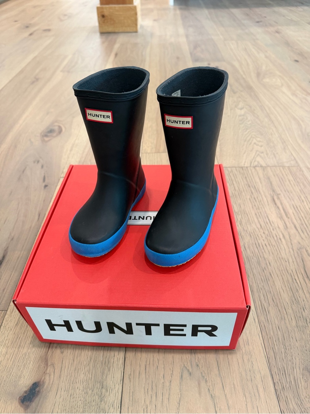 Hunter Kids Black Rain Boots with Blue Soles